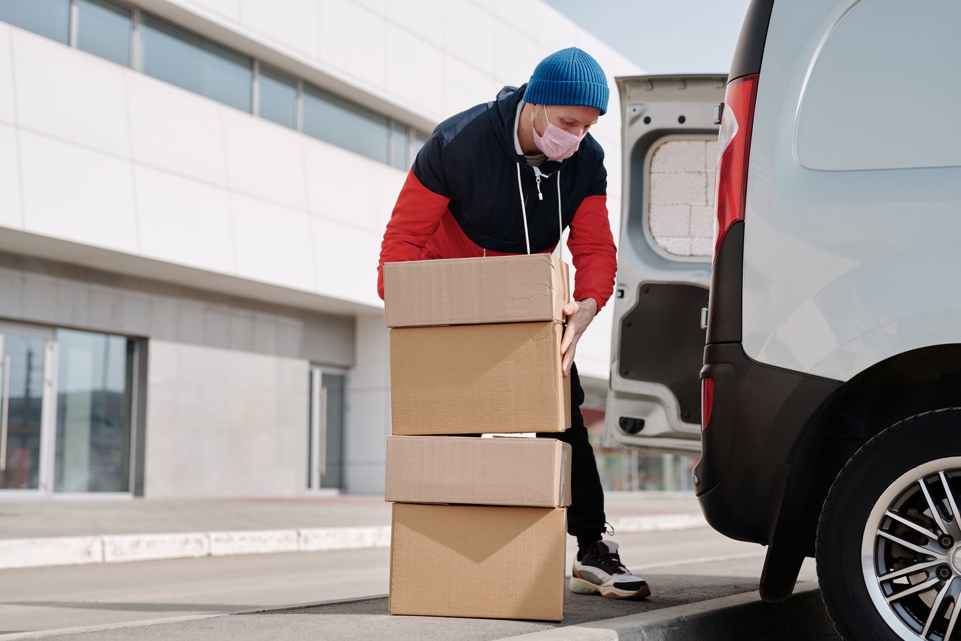 Courier delivering packaged e-commerce parcels